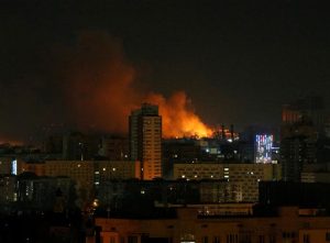 Smoke and flames rise over in Kyiv. Reuters