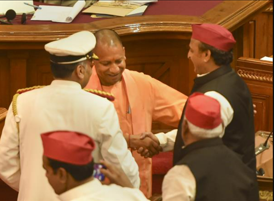 Yogi Adityanath and Leader of Opposition Akhilesh Yadav exchange greetings after taking oath as Members of the Legislative Assembly, in Lucknow on March 28, 2022. — PTI