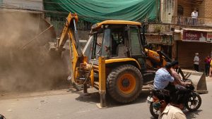 MCD bulldozers demolish illegal structures at Shyam Nagar in New Delhi. Image : The Tribune