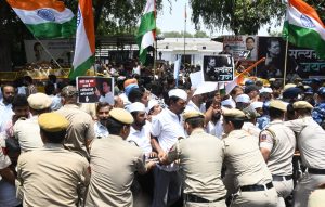 Delhi Police detain Congress workers during their protest march, in New Delhi on Wednesday. Image : The Tribune